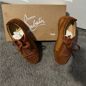 Louis Junior Spikes by Christian Louboutin in the color Foxy Mat